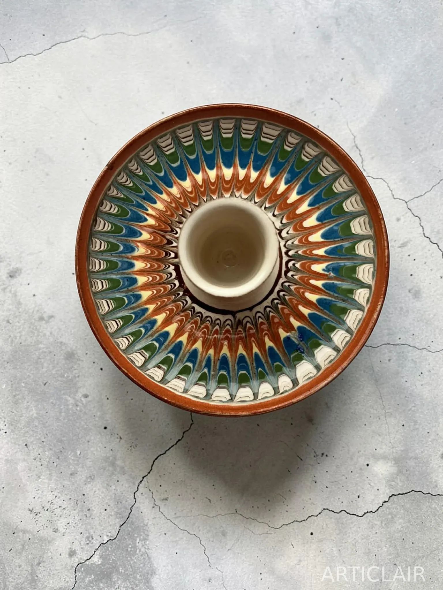 A Horezu candle holder with a wheat design