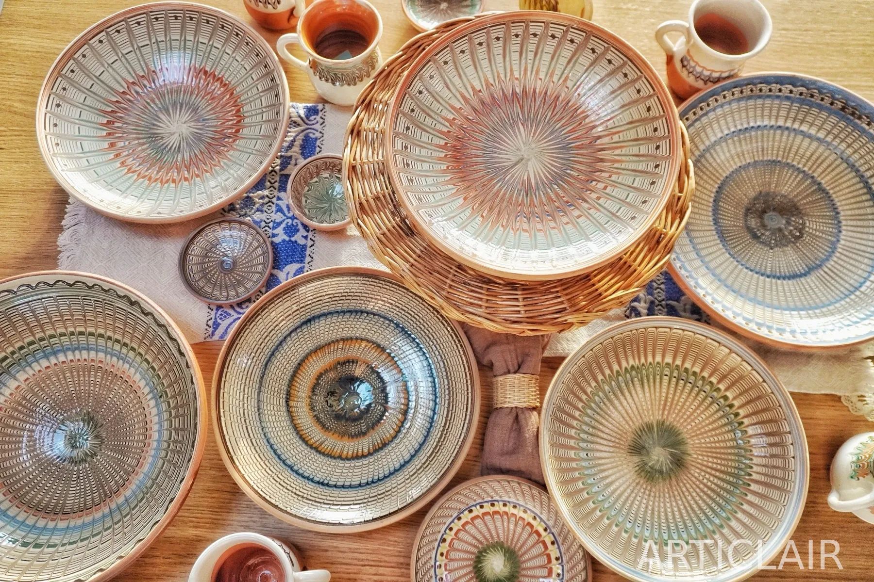 An overhead arrangement of ceramic bowls and cups on a table